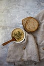 Hummus with herbs alongside fresh baked bread Royalty Free Stock Photo