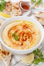 Hummus or houmous, appetizer made of mashed chickpeas, tahini, lemon, garlic, olive oil, parsley and paprika Royalty Free Stock Photo