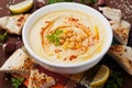 Hummus or houmous, appetizer made of mashed chickpeas, tahini, lemon, garlic, olive oil, parsley and paprika Royalty Free Stock Photo