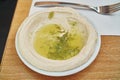 Hummus - a Levantine dip or spread made from cooked, mashed chickpeas or other beans, blended with tahini, olive oil, lemon juice,