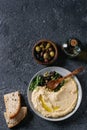 Hummus with olives and herbs Royalty Free Stock Photo