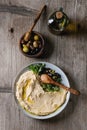 Hummus with olives and herbs Royalty Free Stock Photo