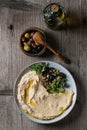 Hummus with olives and herbs Royalty Free Stock Photo