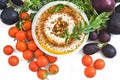Hummus with pine nuts and tomato