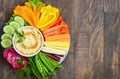 Hummus platter with assorted vegetable snacks. Healthy vegan and vegetarian food.