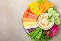 Hummus platter with assorted vegetable snacks. Healthy vegan and vegetarian food.