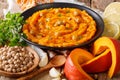 Hummus with pumpkin and ingredients close-up. horizontal Royalty Free Stock Photo