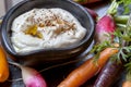 Hummus with Raw Vegetables over Slate Royalty Free Stock Photo