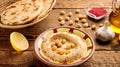 Hummus served in a dish isolated on wooden table background side view of appetizer Royalty Free Stock Photo