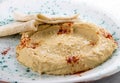 Hummus with sesame lavash. Vegetarian dish. On white background