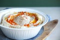 Hummus spread with a wooden spreading knife Royalty Free Stock Photo