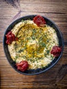 Hummus topped with  sesame seeds, olive oil and chopped cilantro Royalty Free Stock Photo