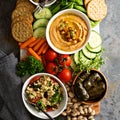 Hummus and vegetables platter with grain salad