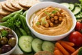 Hummus and vegetables platter with grain salad