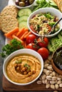 Hummus and vegetables platter with grain salad