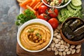 Hummus and vegetables platter with grain salad