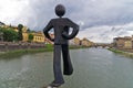 Humorous figure statue of a jumper in front on Ponte Vecchio bridge in Florence Royalty Free Stock Photo