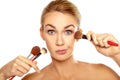 Humorous image of woman with makeup brushes