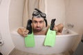 Humorous man snorkeling in the bathtub Royalty Free Stock Photo