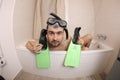 Humorous man snorkeling in the bathtub Royalty Free Stock Photo