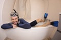 Humorous man snorkeling in the bathtub Royalty Free Stock Photo