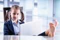 Humorous photo of business child girl working in the office. Horizontal image. Selective focus on eyes of girl. Horizontal image