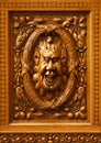 Humorous wooden carved face.