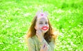 Humour queen concept. Girl sits on grass at grassplot, green background. Girl on cheerful face spend leisure outdoors Royalty Free Stock Photo