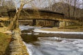 Humpback Covered Bridge Over a Frozen Stream Royalty Free Stock Photo