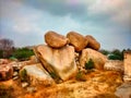 Humpi UNESCO World Heritage Site in east-central Karnataka, India, ruins of humpi, very big stone, three hanging vintage stones,