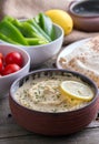 Humus in homemade bowl chapati and vegetable. Royalty Free Stock Photo