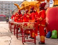 Women in red golden outfits drumming during the ceremonial of the opening of a store in Hunchun city of China, Jilin