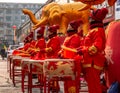 Women in red golden outfits drumming during the ceremonial of the opening of a store in Hunchun city of China, Jilin