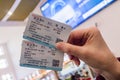 HUNCHUN, JILIN, CHINA - March 8, 2018: Two tickets in a woman`s hand for travel by high-speed train CRH Royalty Free Stock Photo