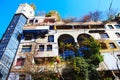 Hundertwasser house in Vienna, Austria. The Hundertwasserhaus apartment block has colorful facade, undulating floors, a roof Royalty Free Stock Photo