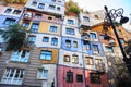 Hundertwasser house in Vienna, Austria. The Hundertwasserhaus apartment block has colorful facade, undulating floors, a roof Royalty Free Stock Photo