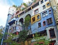 Hundertwasser House, Wien Artist`s creation of brightly painted, natural apartment block with a forested roof & balconies