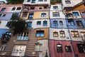 a building made of multiple multi - story units is shown from below