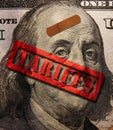 Hundred dollar bill with bandage and red Tariffs stamp Royalty Free Stock Photo
