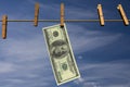 Hundred dollar bill hanging on a clothesline Royalty Free Stock Photo