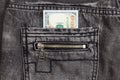 Hundred dollar bill inside back pocket jeans Royalty Free Stock Photo