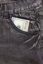 Hundred dollar bill inside front pocket jeans Royalty Free Stock Photo