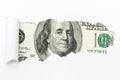 A hundred-dollar bill in a white background rupture. A hole in a white background. Hidden money, tax evasion