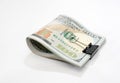 Hundred dollar bills with metal clip on white. Close-up Royalty Free Stock Photo