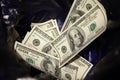 Hundred-dollar bills in the trash. The fall of the dollar on the stock exchange Royalty Free Stock Photo