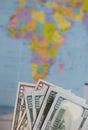 Hundred dollar and fifty dollar bills. Against the background of a world map. The silhouette of Africa is visible on it Royalty Free Stock Photo