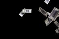 Hundred dollars banknotes fly on black background. money rain concept