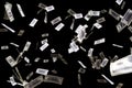 Hundred dollars banknotes fly on black background. money rain concept