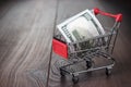 A hundred dollars in the shopping trolley Royalty Free Stock Photo