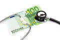 Hundred euro note with professional stethoscope on white background Royalty Free Stock Photo